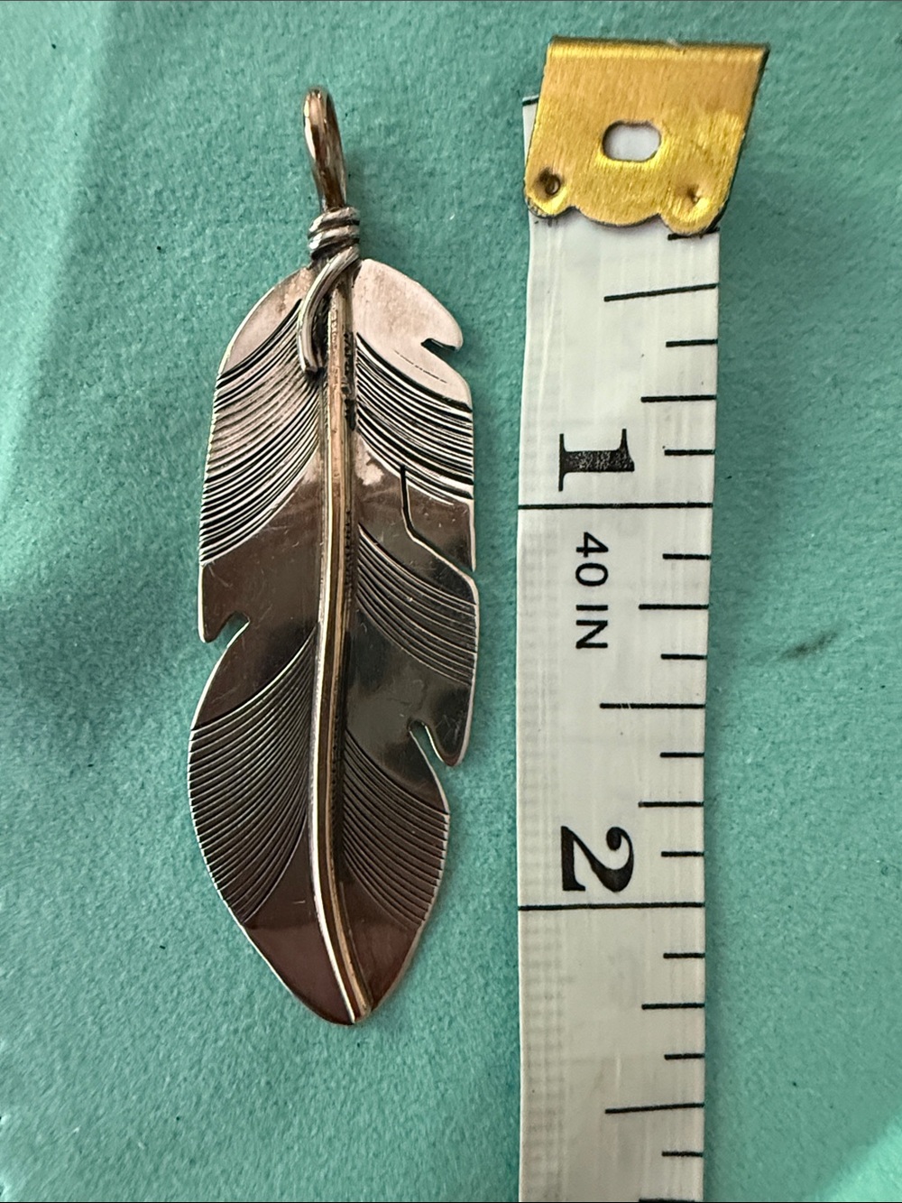 Sterling Silver and 12kyg Feather Pendant
